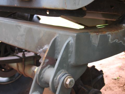 1980 Jeep CJ7 - This image shows a detailed view of a vehicle's undercarriage, focusing on the frame and suspension system.