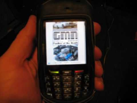 1997 Ford Crown Victoria - A photo of an engine bay is displayed on a mobile phone screen.