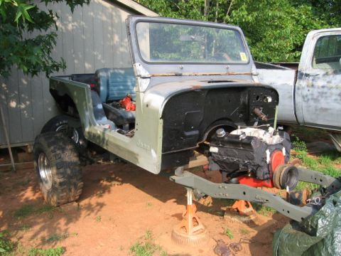 1980 Jeep CJ7 - This 1980 Jeep CJ7 is undergoing a major overhaul, with the engine removed and the chassis supported.