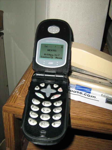 1988 Mercury Grand Marquis - A Motorola Nextel 2530 flip phone is shown open, displaying the screen and keypad.