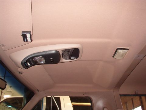 1983 Ford Bronco - Interior shot of a vehicle's headliner, showing the overhead console and lighting fixtures.