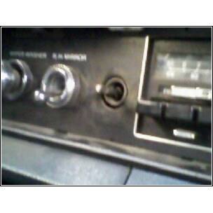 1973 Ford Ranchero - Dashboard detail showing the radio and controls, with 'SUPER RANCHER' text visible.