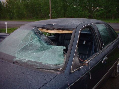 1996 Ford Crown Victoria - This 1996 Ford Crown Victoria has extensive damage to its roof and windshield.
