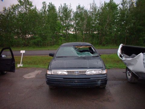 1996 Ford Crown Victoria - This 1996 Ford Crown Victoria shows significant damage to its windshield and appears to have been involved in an incident.