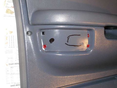 2001 Ford Crown Victoria - Place the soon-to-be installed lense and bulb housing over the panel and mark where to cut.