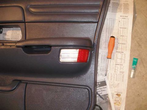 2001 Ford Crown Victoria - Unlike OEM doors with courtesy lamps, there are no other ways to secure the new lense and buld housing but with an adhesive.