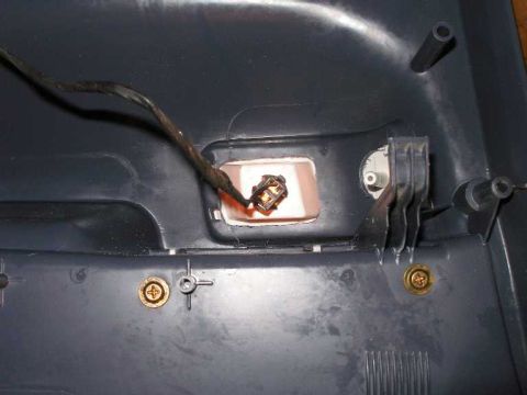2001 Ford Crown Victoria - Close-up view of the wiring harness connector for a door courtesy lamp.