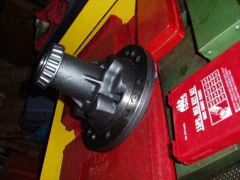 1980 Ford Bronco - A differential carrier with a bearing is shown resting on toolboxes.