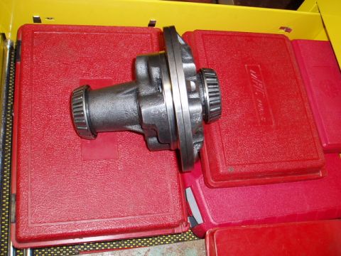1980 Ford Bronco - A differential carrier with bearings rests on red toolboxes, with "SUPERMOTORS" visible at the bottom.