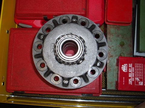 1980 Ford Bronco - A differential carrier with a bearing is shown, surrounded by red toolboxes and a MAC Tools hex key set.