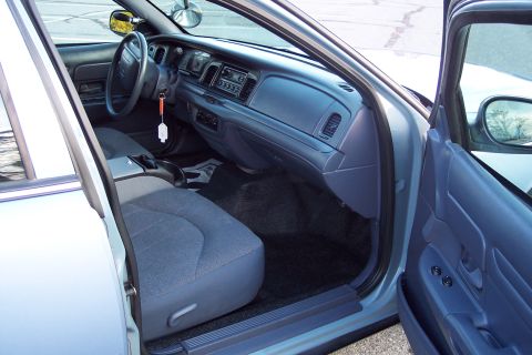 2001 Ford Crown Victoria - Interior view of a 2001 Ford Crown Victoria, showing the dashboard and front seats.
