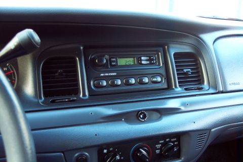 2001 Ford Crown Victoria - Interior view of a 2001 Ford Crown Victoria dashboard, highlighting the center console with radio and climate controls.