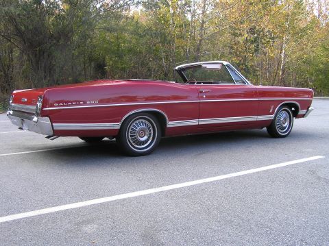 1967 Ford Galaxie - Red 1967 Ford Galaxie convertible with chrome trim and white convertible top.