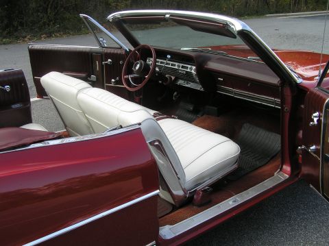 1967 Ford Galaxie - Interior of a 1967 Ford Galaxie convertible, showing the dashboard, seats, and door panels.