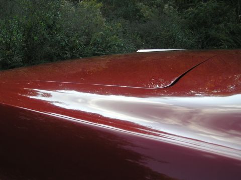 1967 Ford Galaxie - Close-up of the hood on a 1967 Ford Galaxie, showing its distinctive body lines.