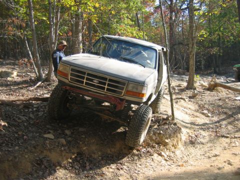 1992 Ford Mustang - Ford pickup truck with modified suspension on an off-road trail.