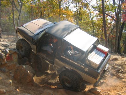 1992 Ford Mustang - This 1992 Ford Bronco is shown off-roading on a rocky trail during autumn.