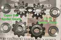 1996 Ford Bronco - Spider gears and bearings for a differential are shown on a newspaper background.