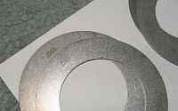 1996 Ford Bronco - Two circular metal parts are shown, possibly for a vehicle rebuild.