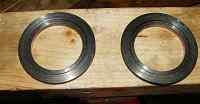 1996 Ford Bronco - Two metal rings are shown resting on a wooden plank.