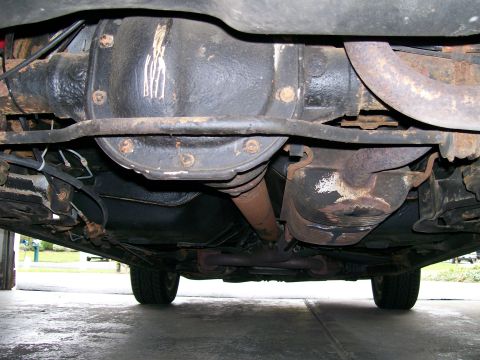 1995 Mercury Grand Marquis - Underside view of a 1995 Mercury Grand Marquis, showing the rear differential and exhaust components.