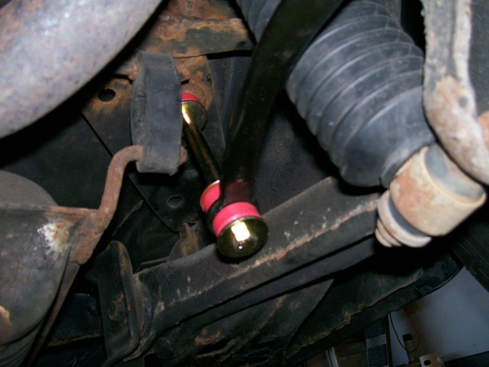 Rear sway bar with red bushings and gold hardware