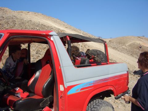 1985 Ford Bronco - Off-roading in a 1985 Ford Bronco with friends and a dog on a sunny day.