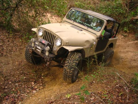 2001 Jeep Wrangler - This Jeep CJ-7 is navigating a challenging off-road trail.