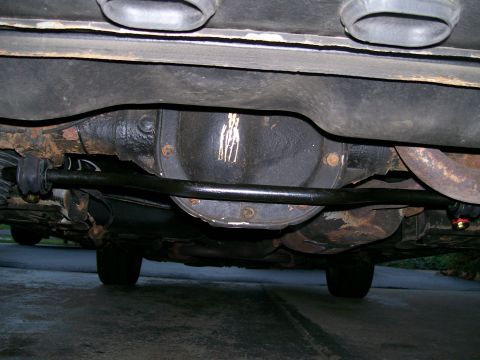1995 Mercury Grand Marquis - This photo shows the underside of a vehicle, focusing on the rear differential and sway bar assembly.