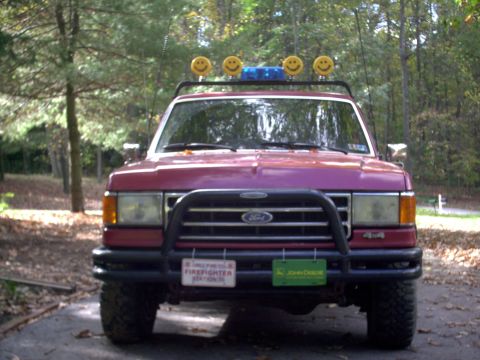 1989 Ford Bronco - This 1989 Ford Bronco features a custom bull bar and decorative smiley face lights mounted on the roof rack.