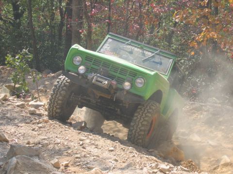 1992 Ford Mustang - This modified first-generation Ford Bronco navigates a rocky trail, demonstrating its off-road capabilities.