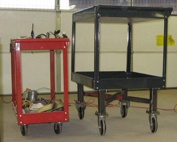 Two rolling carts, one red and one black, in a garage setting