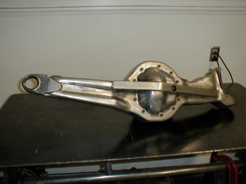 1996 Ford Bronco - Polished metal rear axle differential housing shown on a table.
