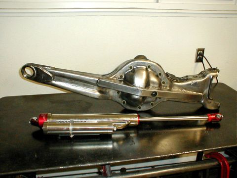 1996 Ford Bronco - Rear axle and shock absorber assembly, possibly for a 1996 Ford Bronco.