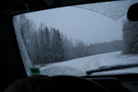 2003 Jeep TJ - Driving through a winter landscape on a snow-covered road, viewed from inside the vehicle.