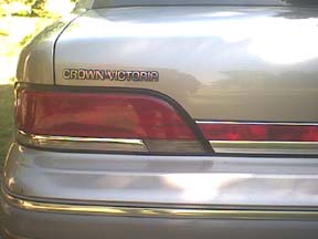 1994 Ford Crown Victoria - Close-up of the rear taillight and trunk badging on a Crown Victoria.