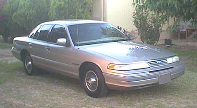 Silver 1994 Ford Crown Victoria sedan, 3/4 front view