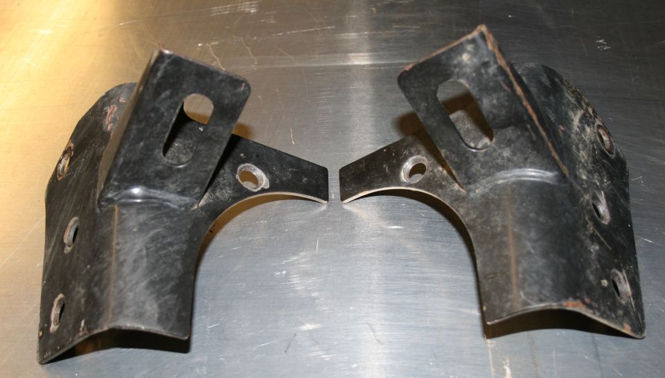 two black metal brackets with mounting holes