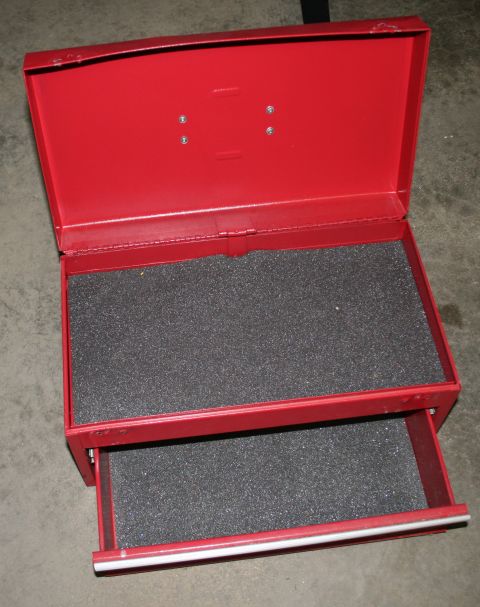 2003 Jeep TJ - A red metal toolbox with foam lining is shown open, revealing two compartments.