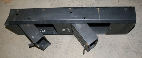 2003 Jeep TJ - Black bumper part with angled metal brackets, likely for a vehicle.