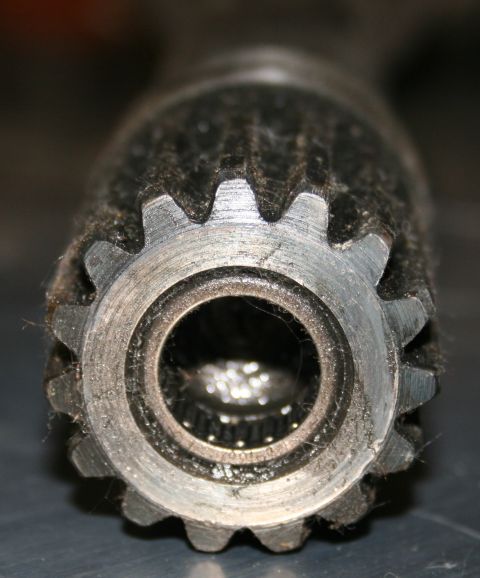 2003 Jeep TJ - This is a close-up view of a metal gear shaft, showing its splined end and internal bearings.