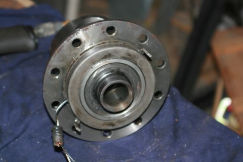 1990 Ford Bronco - From the bottom of the carrier you can see the magnet assembly. Be very careful with the carrier because it's easy to break off those two e…
