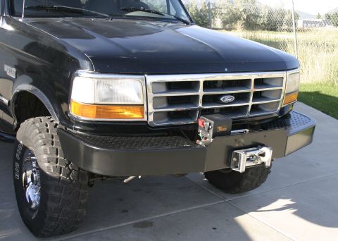 1994 Ford Bronco - Front view of a 1994 Ford Bronco, an aftermarket winch bumper and chrome grille.