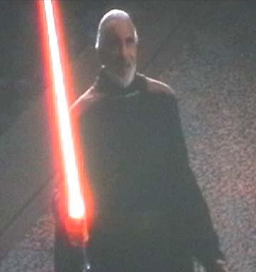 1994 Ford Crown Victoria - A man holds a glowing red lightsaber, with the Supermotors.net logo in the lower right corner.