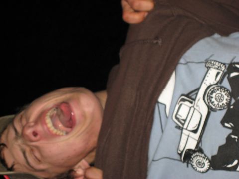 1966 Jeep CJ5 - A person is shown with their tongue sticking out, wearing a shirt with a graphic of a vehicle.