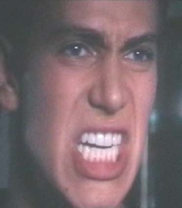 1994 Ford Crown Victoria - A close-up of a man's face with an intense, angry expression and his teeth bared.