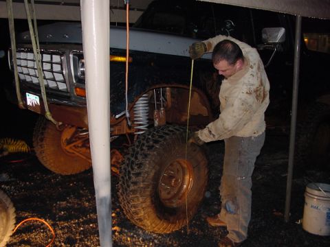 1979 Ford Bronco - A man measures the tire of a 1979 Ford Bronco during a spring test.