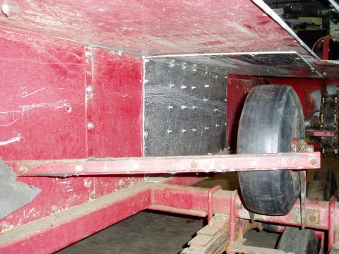 2000 Ford E350 - Close-up of trailer chassis components, including a wheel and suspension system.
