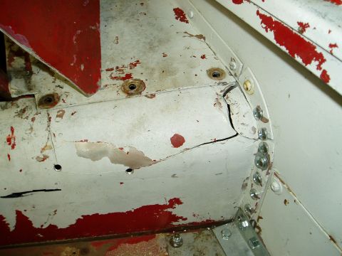 2000 Ford E350 - This image shows damage to the vehicle's frame, with a significant crack and rust evident.