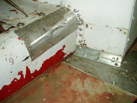 2000 Ford E350 - Close-up view of interior metalwork with visible repairs and wear.